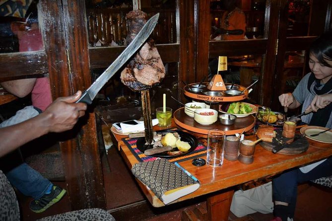 Carnivore Restaurant: Lunch or Dinner Experience in Nairobi - Table-side carving and the Maasai sword skewer experience