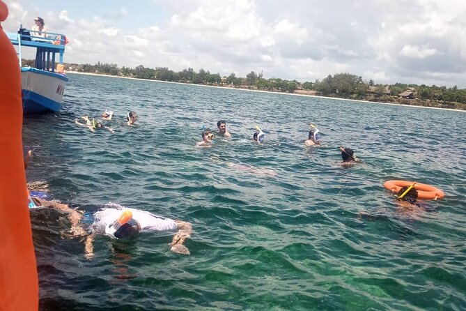 Diani Beach: Glass-bottom Boat Ride with Underwater Show - From your Diani Beach hotel to the public beach, by tuktuk