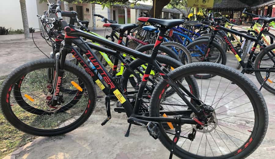 Diani Beach: Village tour on a bike with hotel pick-up - Leaving Diani Beach by bike, not by car