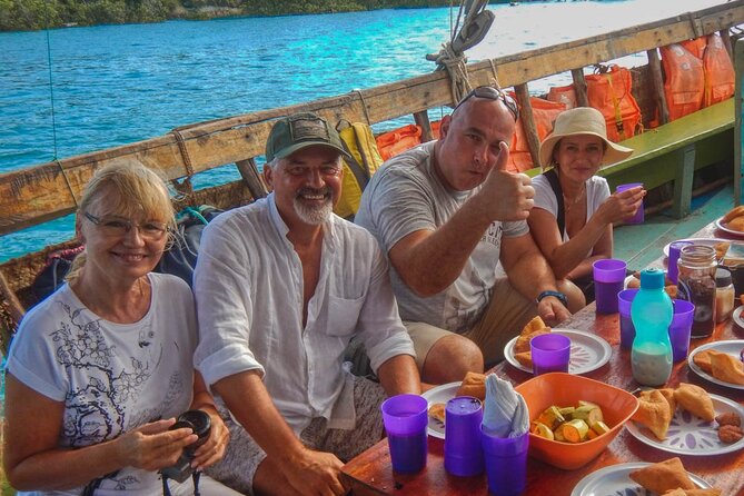 Full-Day Special Wasini Island Tour with Snorkeling and Lunch - Onboard comfort: breakfast, toilets, waterproof photos, and the little extras