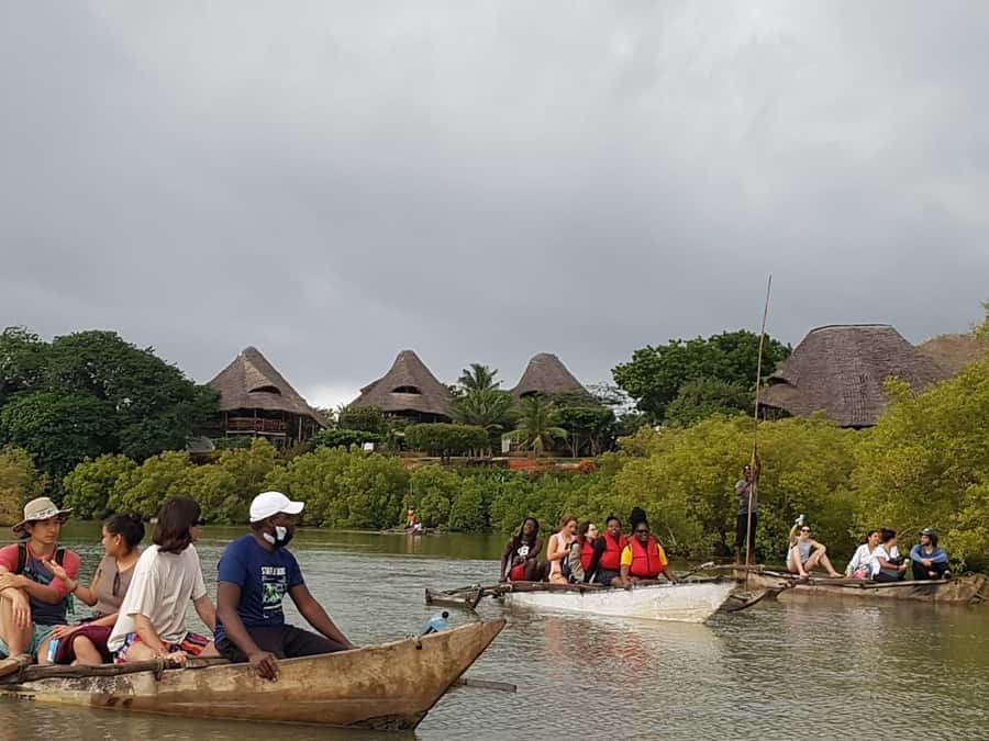 mangrove tour - Boarding a Traditional Canoe and Cruising Upstream