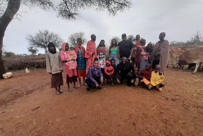 Masai village day tour. - Inside a Maasai village visit: welcome dance and home life