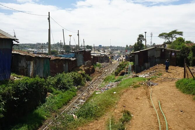 The Kibera Empowerment Walking Tour - Stop 1: Moses’s House, then a walk along Kibera’s railroad tracks